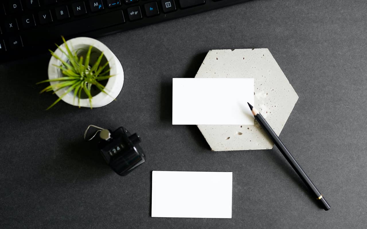 a black pen and white cards