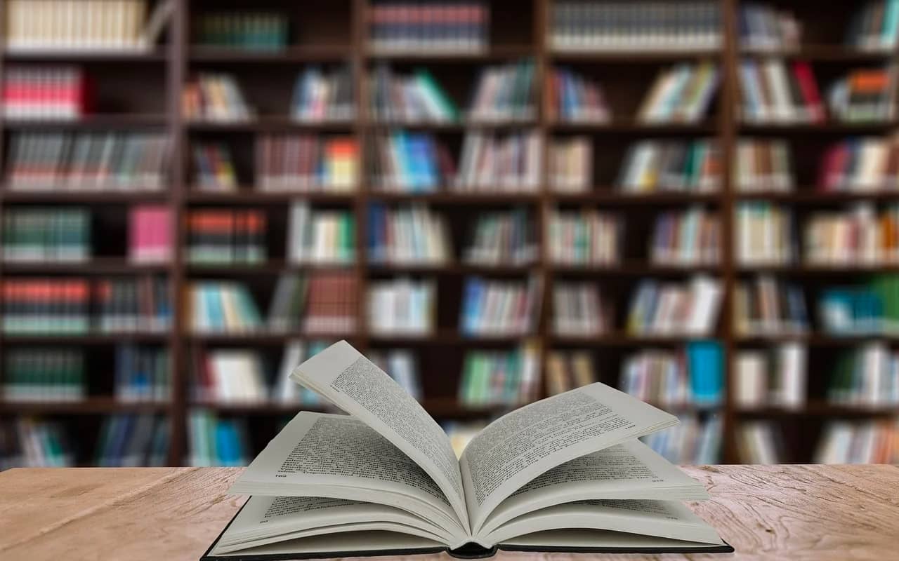 a book on a desk in a library