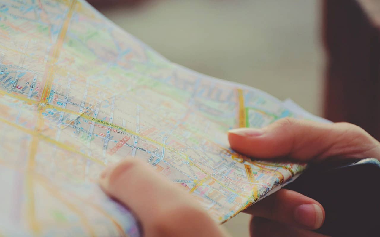 a person is holding a map