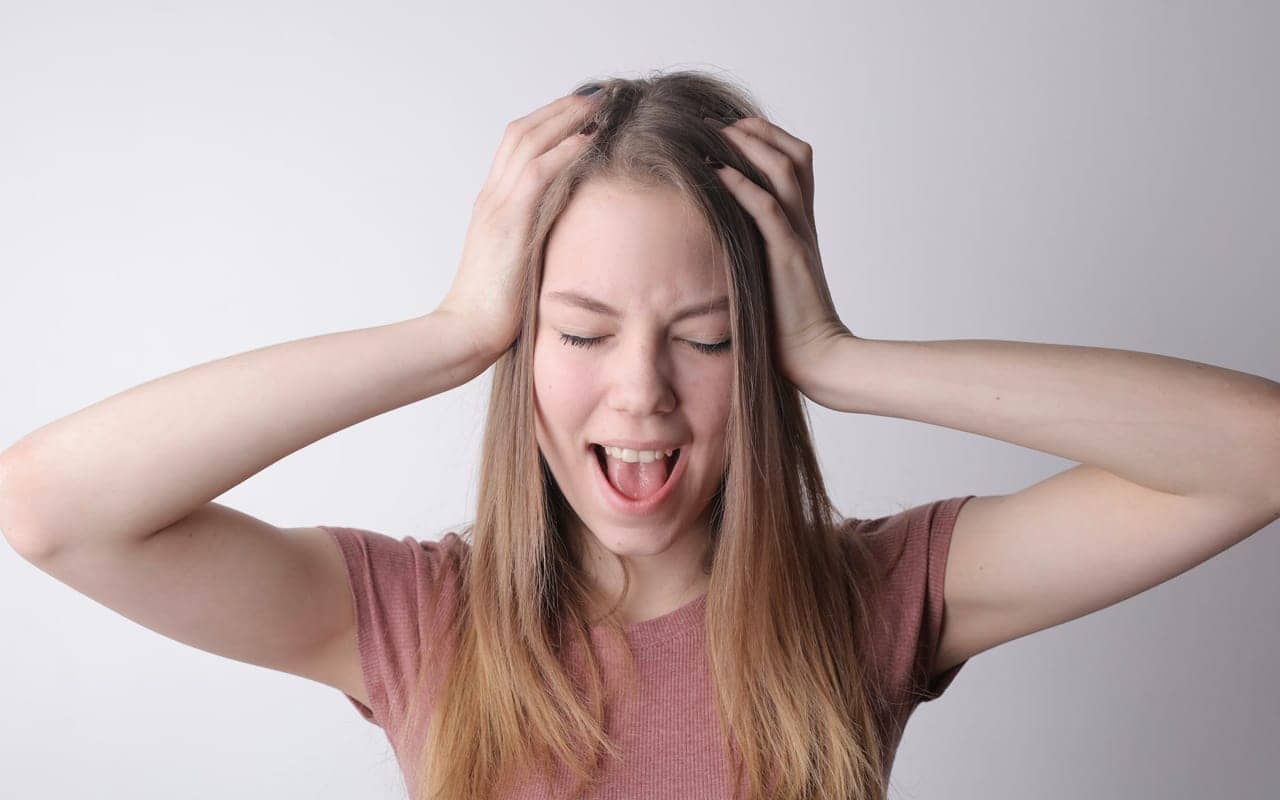 a pink shirt woman is not happy