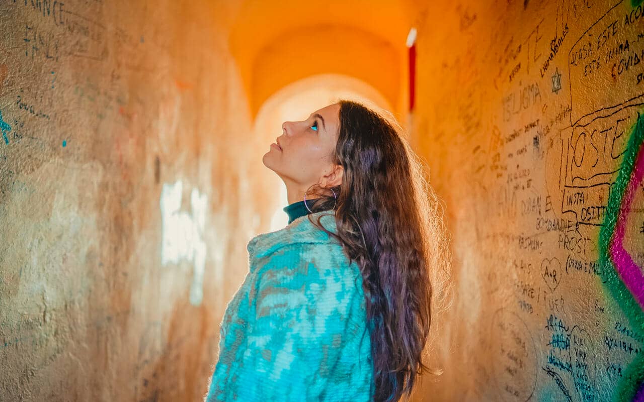 a woman is reading from the walls