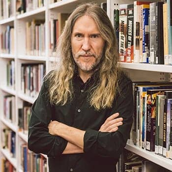 Anthony Metivier with books for this memory coaching feature image