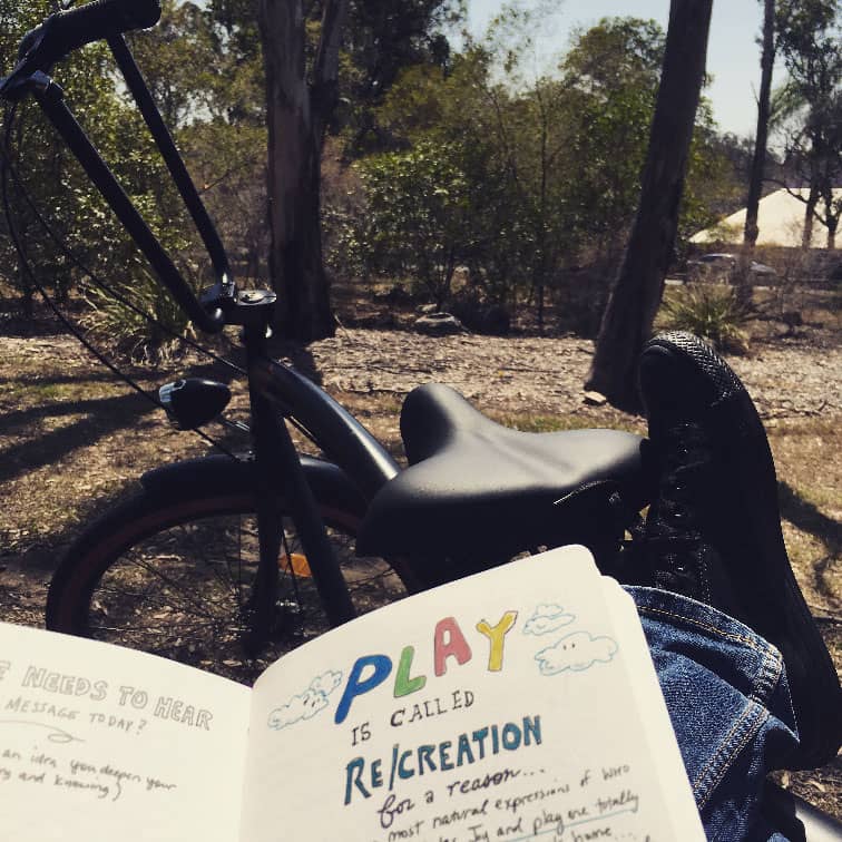 Anthony Metivier with Cosmic Journal in a park in Brisbane