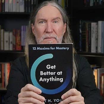 Anthony Metivier with a copy of Get Better At Anything by Scott Young
