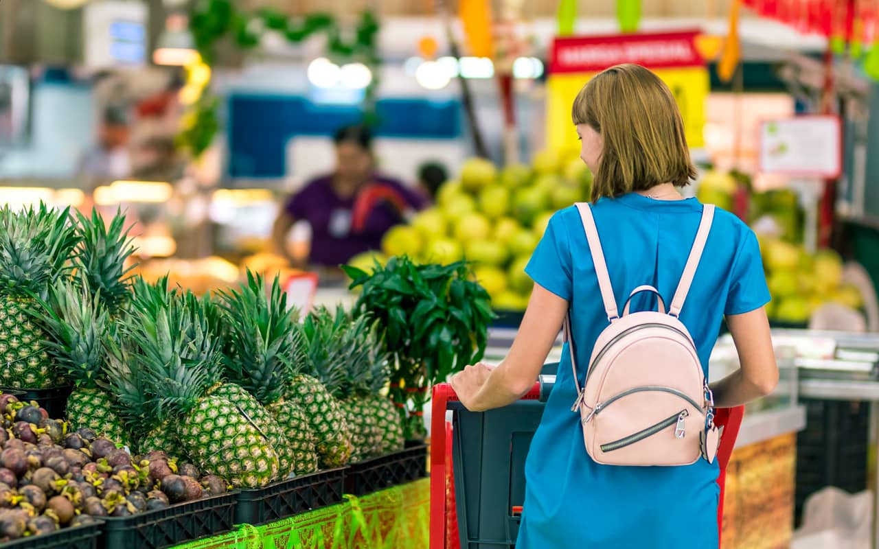 blue dress woman is grocery shopping