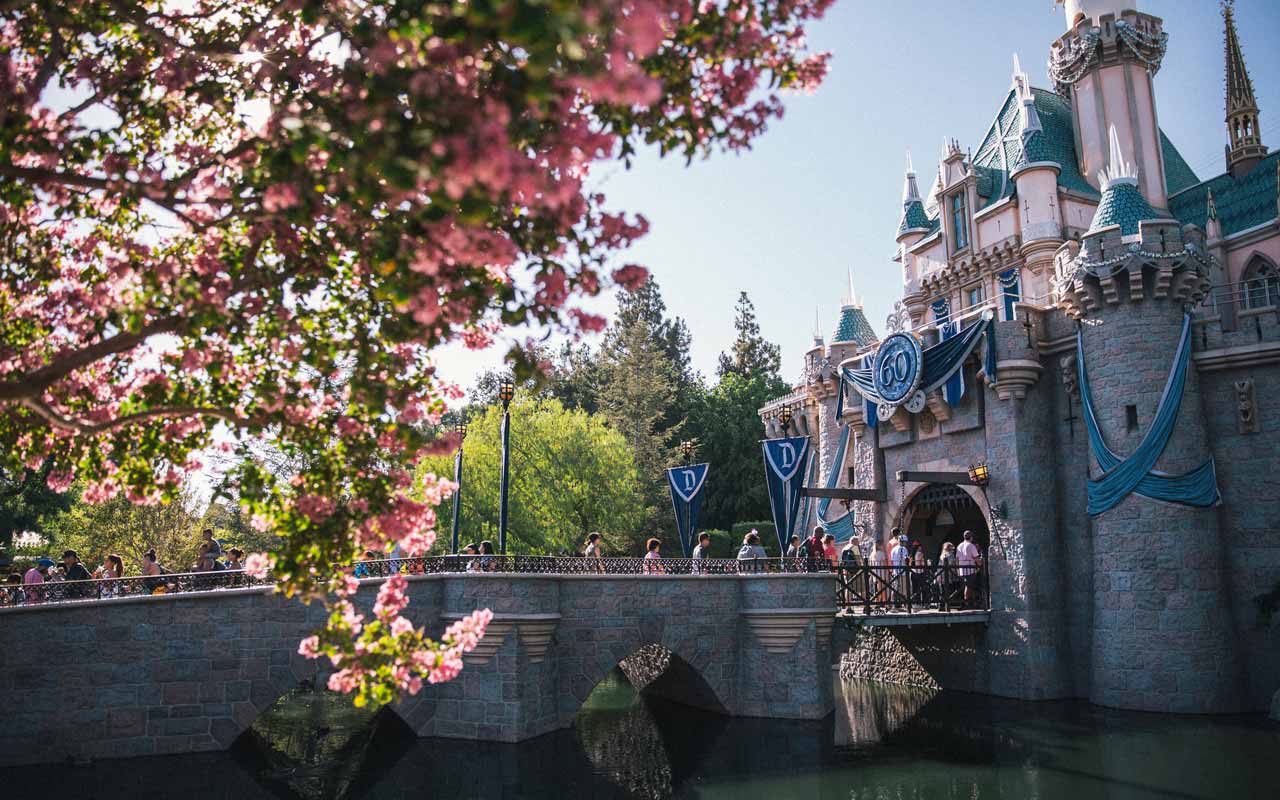 People cross a bridge at one of the Disney resorts.