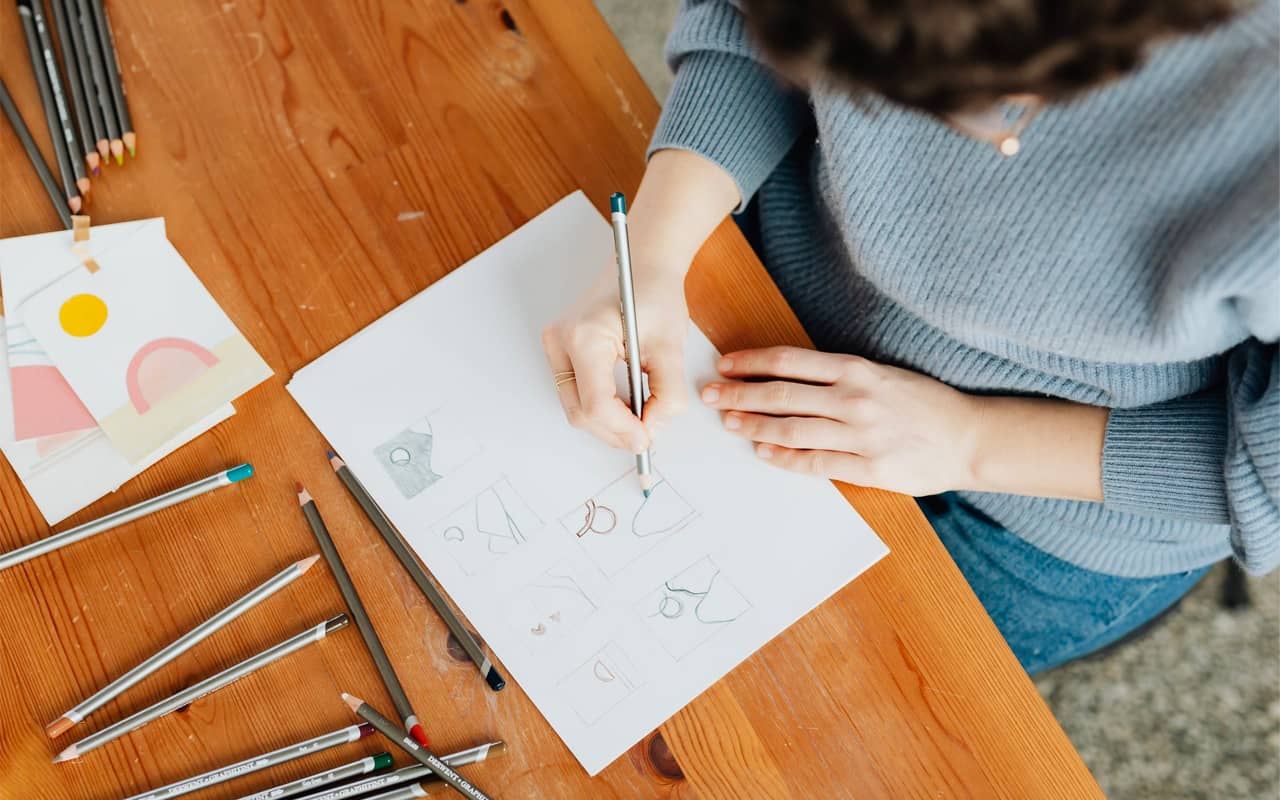 woman drawing graphs by hand to improve reading comprehension