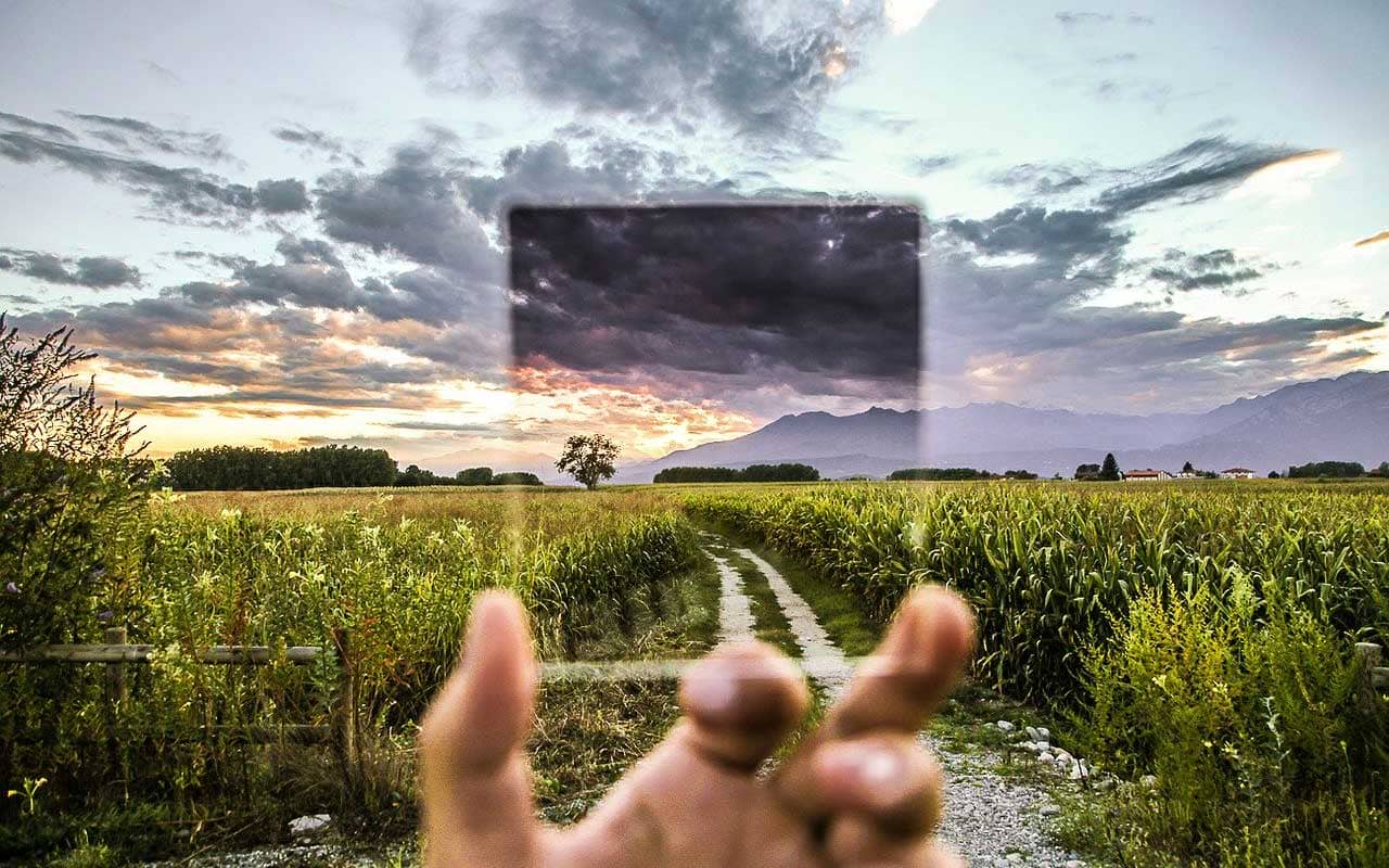 The filter of selective attention, like this picture of a filter looking out over a cornfield with mountains in the distance