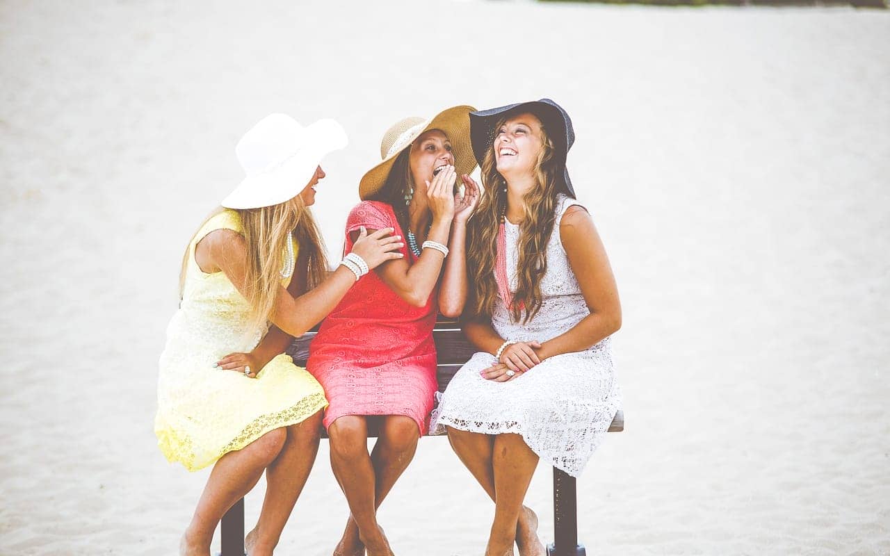 happy women sitting on a chair
