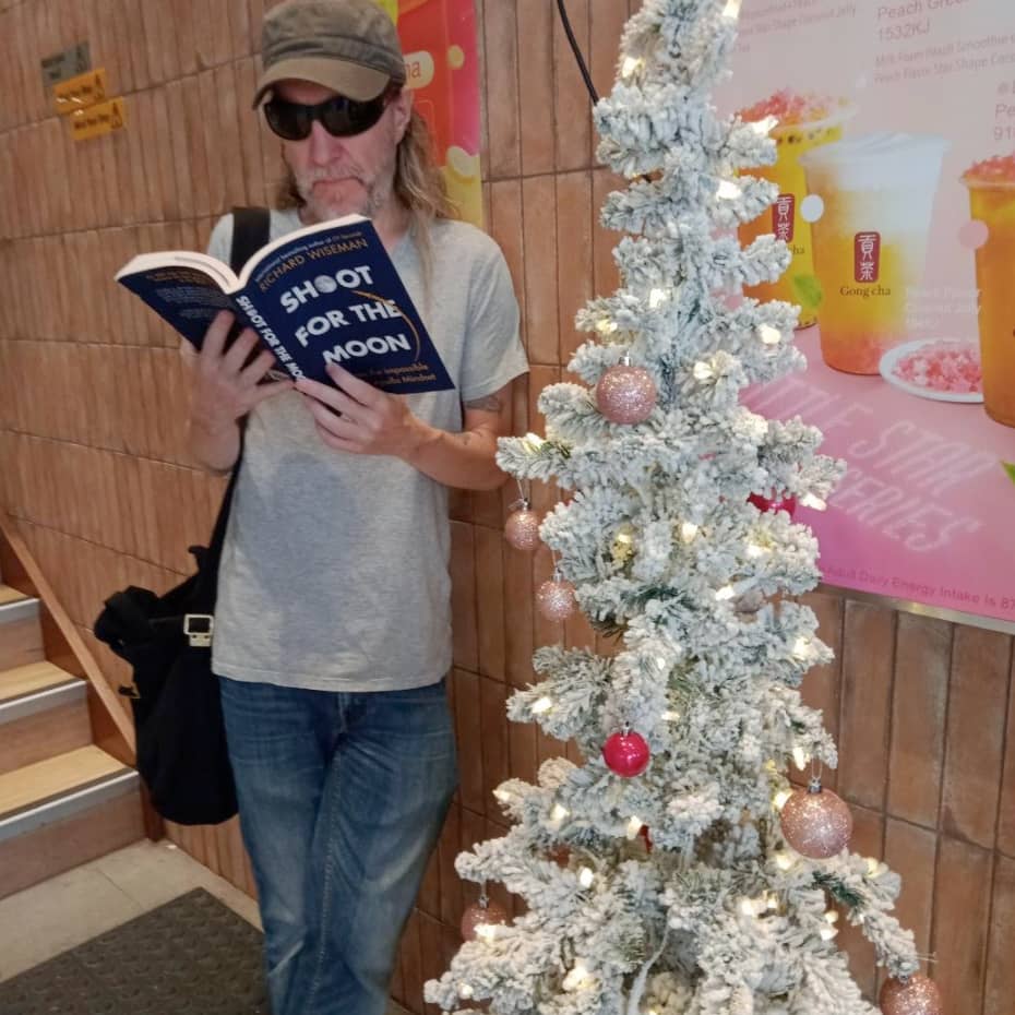 Anthony Metivier reading a book