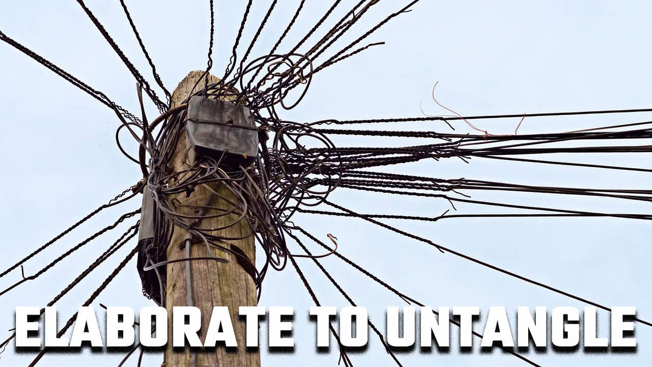 Image of a tangled set of electrical wires on a pole