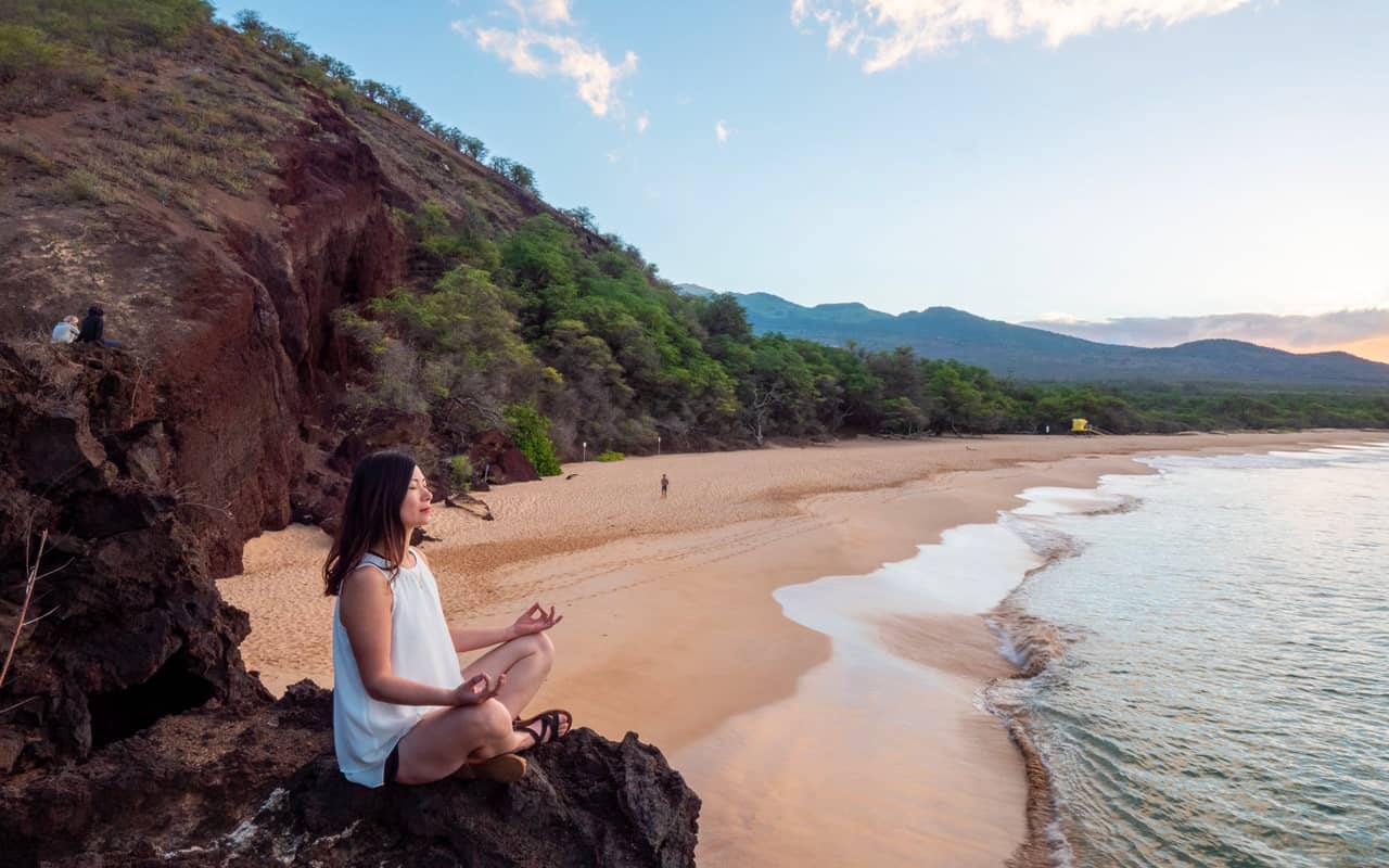 meditating on a beach