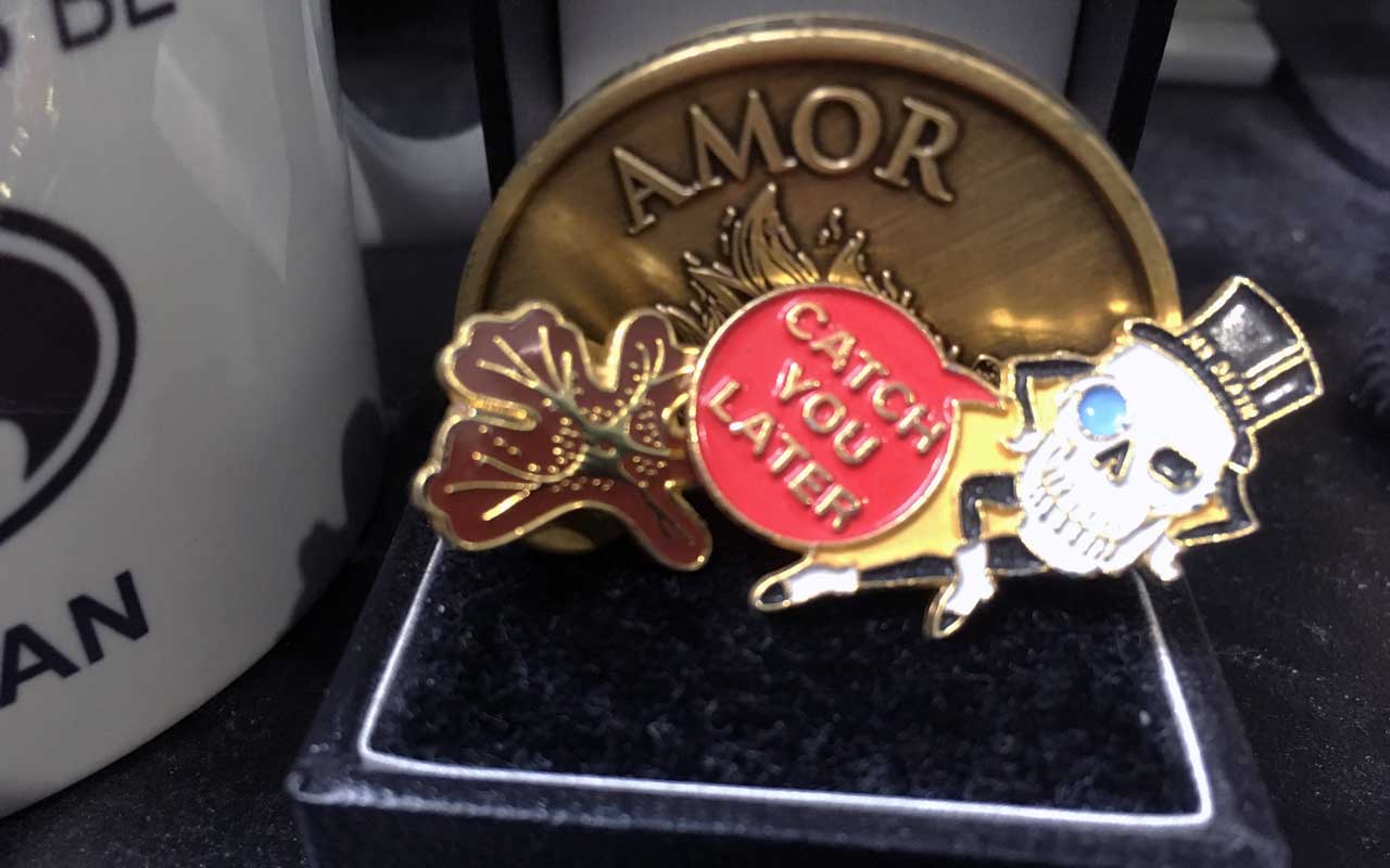 A photo of Mr Death, a skull pin that looks like Mr Peanut.