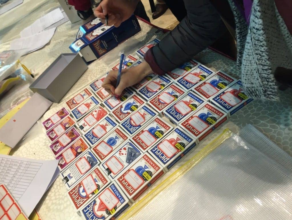 A Memory Arbiter signing off on decks of memorized playing cards