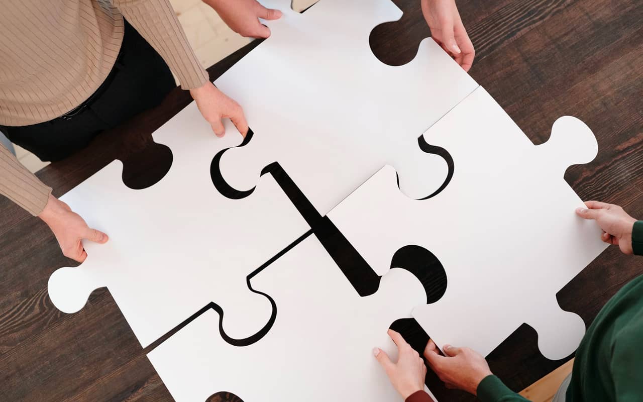 people are putting together a puzzle