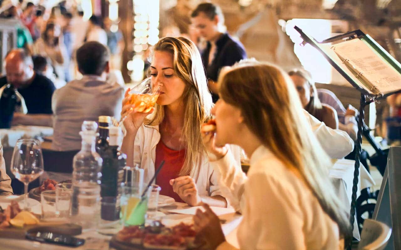 people in a restaurant enjoying the food