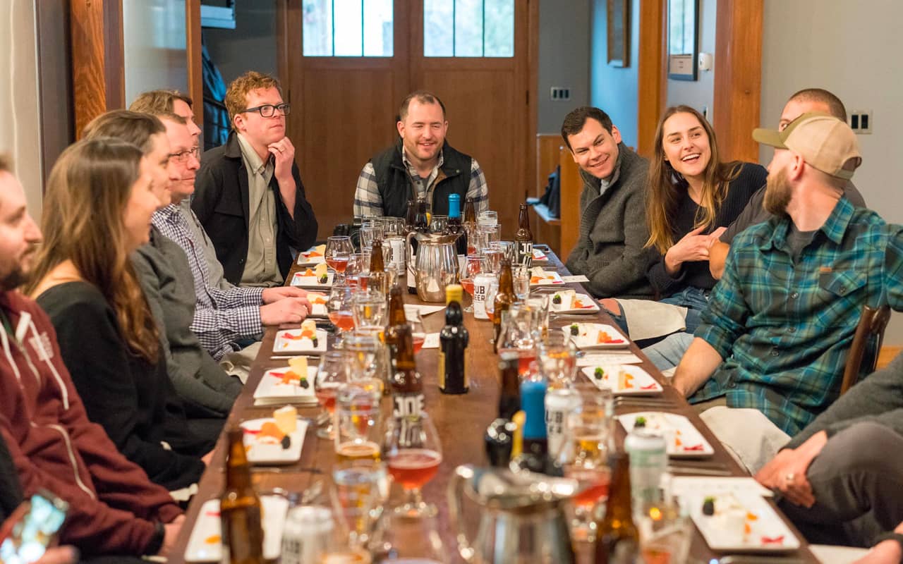 people talk to each other around a table