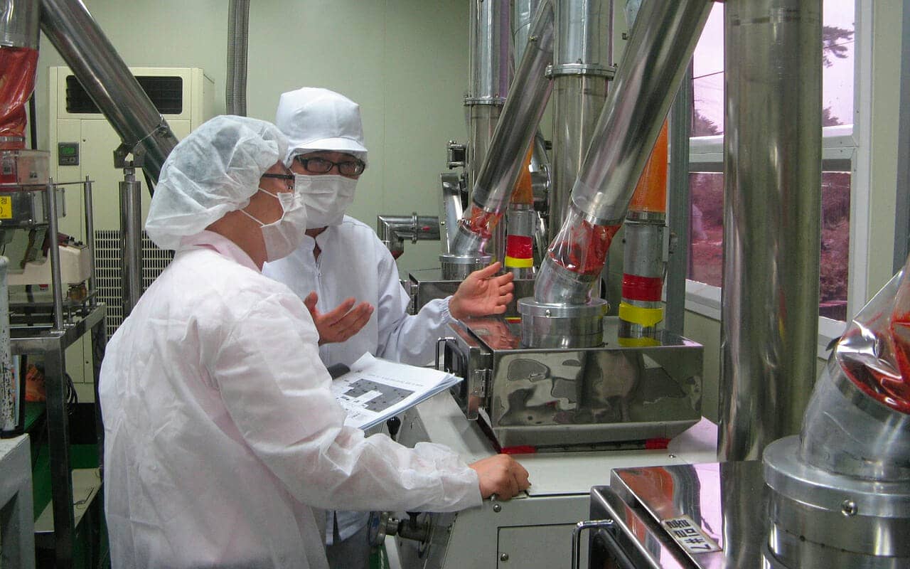 Scientists in a lab producing foods bad for brain