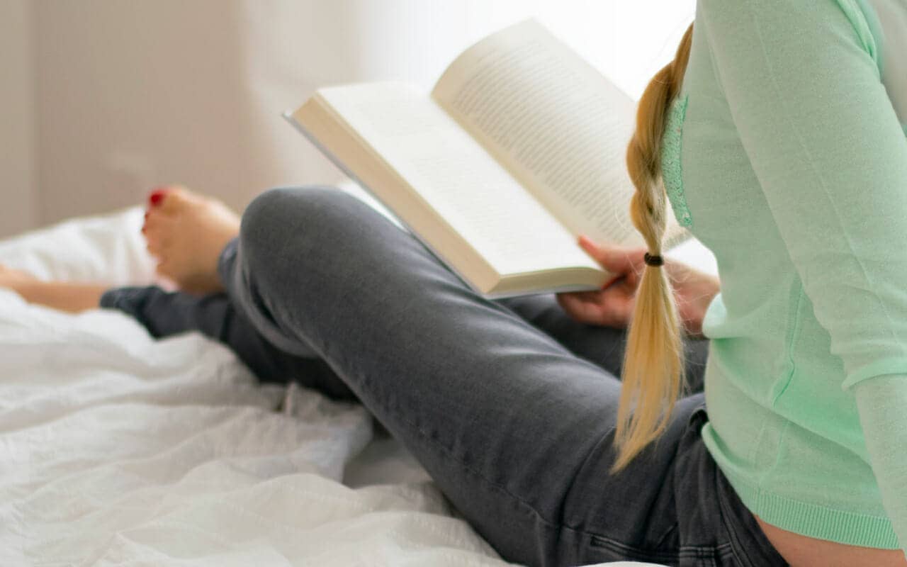 sitting in bed and reading