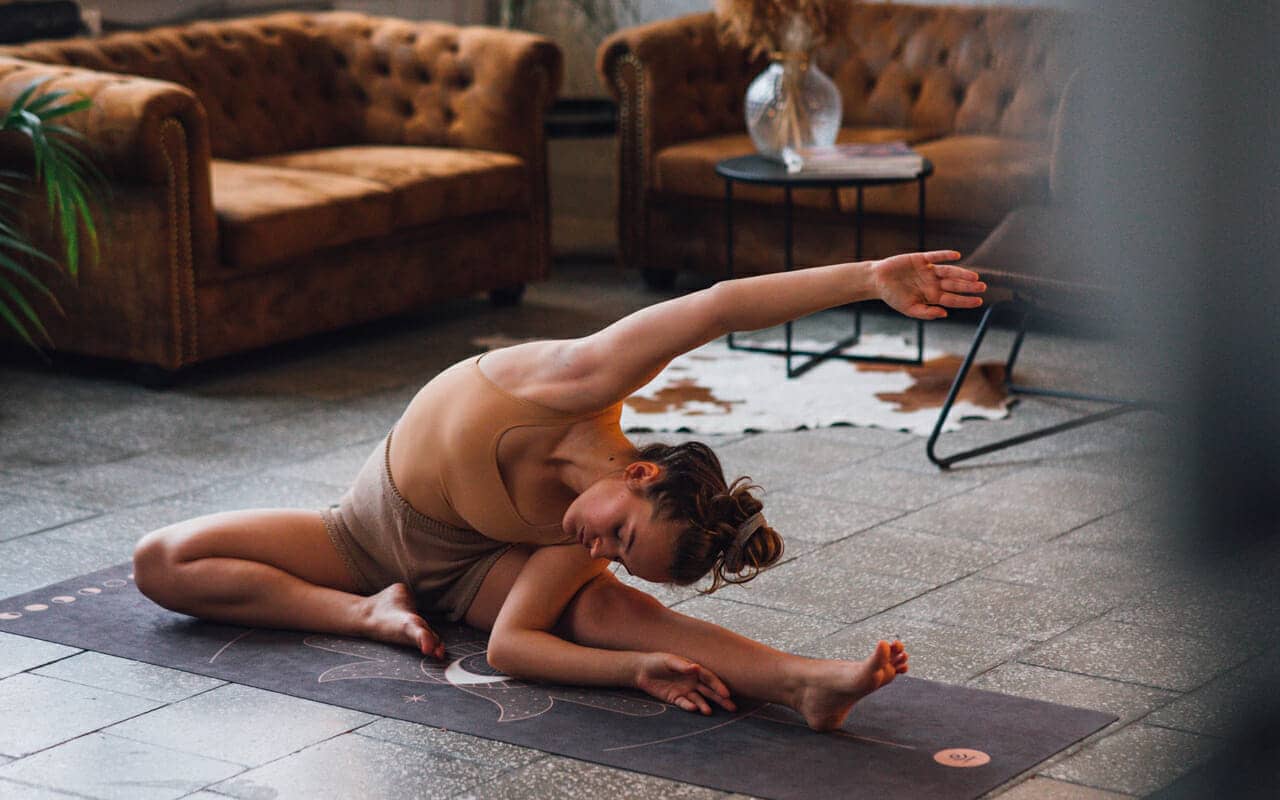 stretching in a sofa room