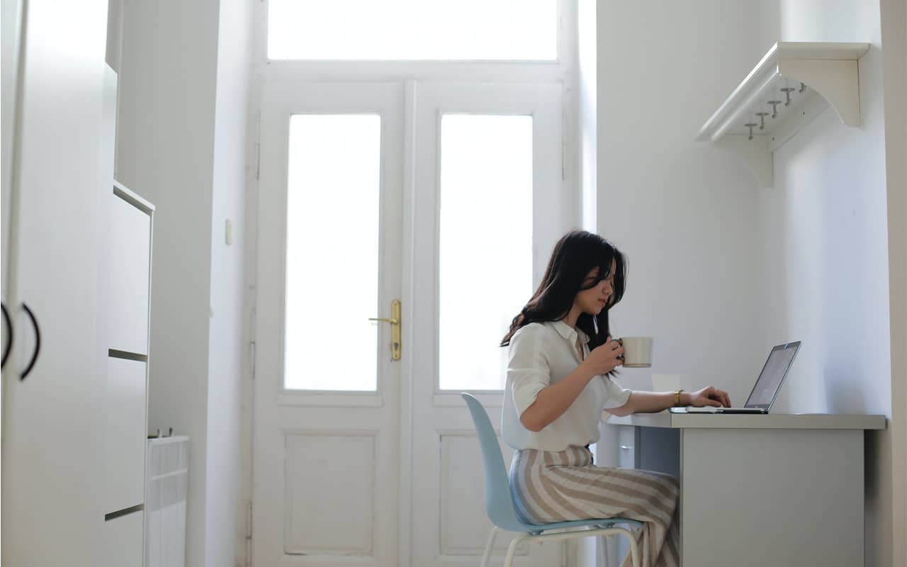 woman at a desk with laptop