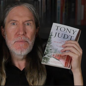 Anthony Metivier holding a copy of The Memory Chalet by Tony Judt